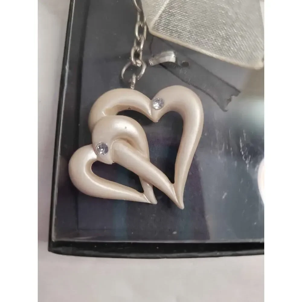 4 Pearl white double heart keychain.